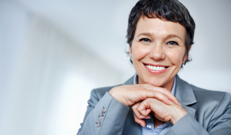 6 Vital Steps when Onboarding Executives | Outplacement Services Florida | FL Executive Search, Executive Recruiting Firm, Orlando Career Coaching Services happy female employee